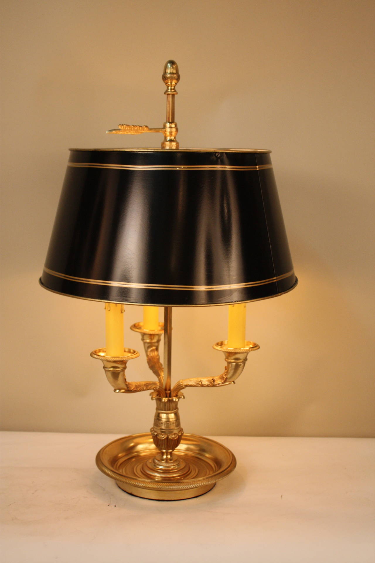 A beautiful bronze French Empire bouillotte lamp, with adjustable shade.
This lamp has three lights max 60 watt each.