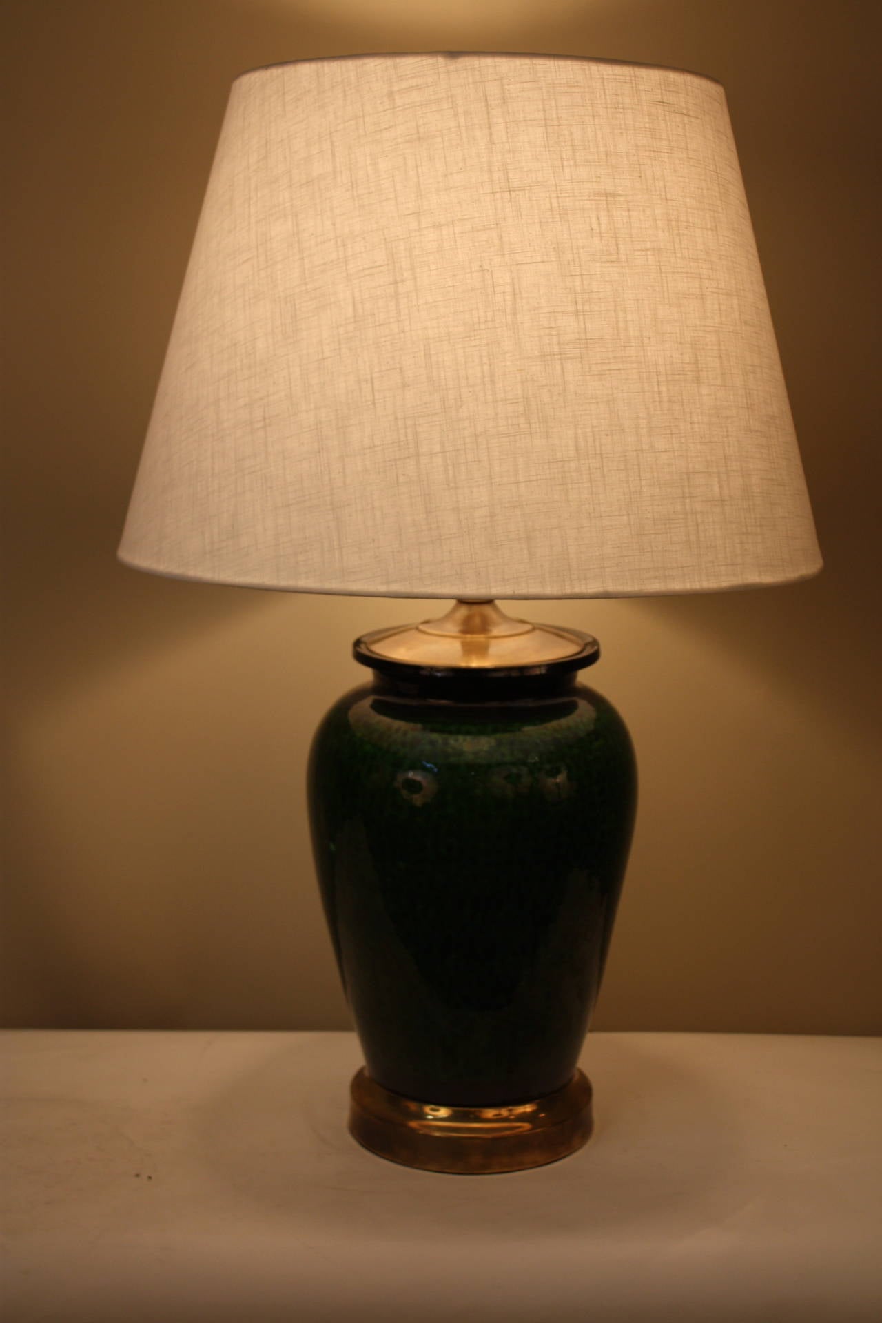 This wonderful lamp was made from French, 1950s high glazed emerald green pottery and bronze mounting.