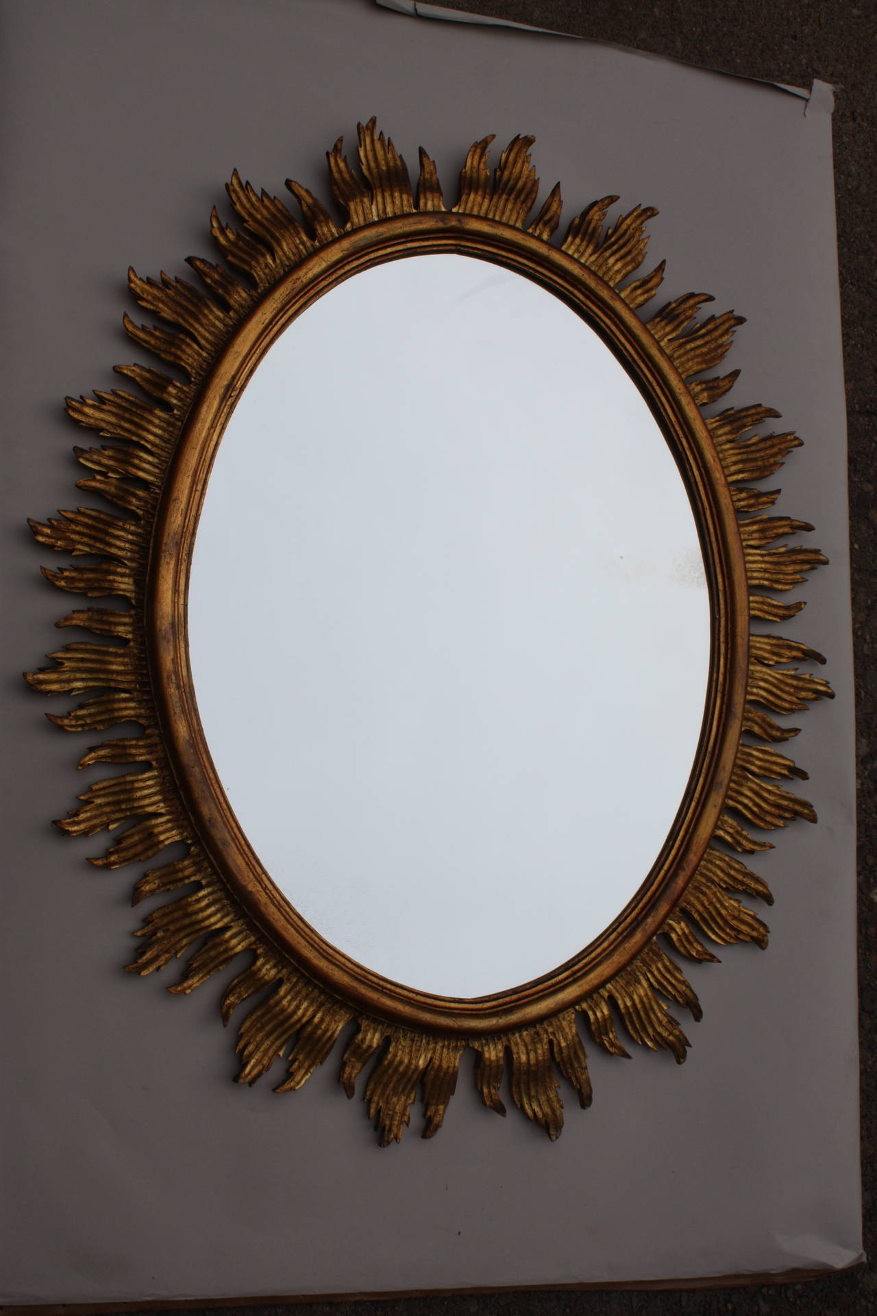 Giltwood oval shape French sun mirror.