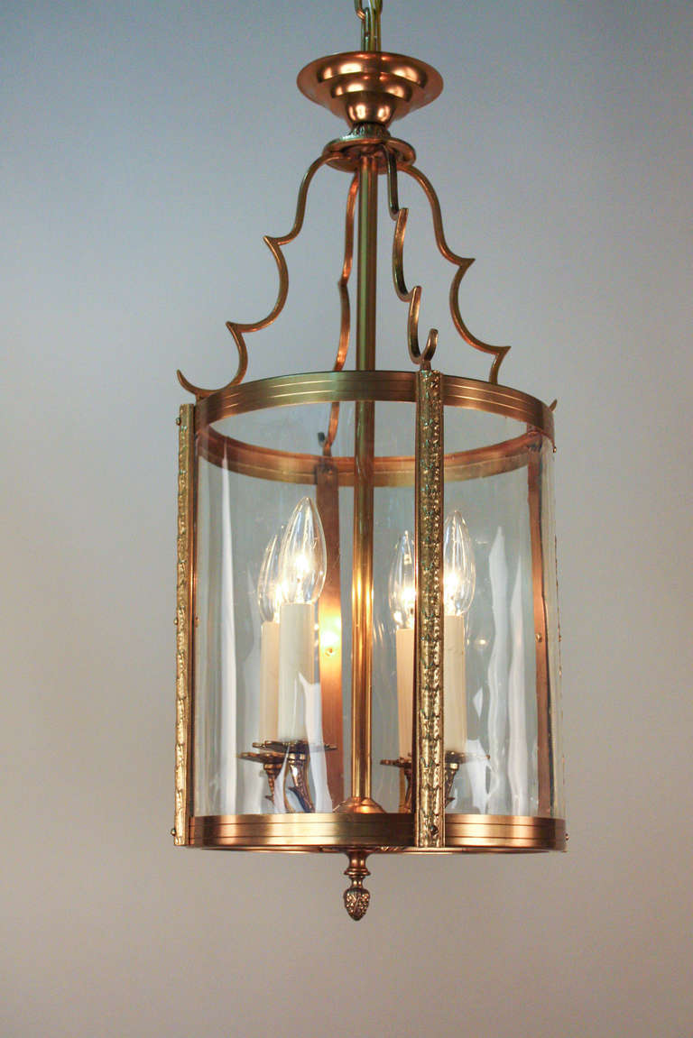 Originally crafted in France during the 1930's, this beautiful bronze lantern is filled with fantastic detail work from top to bottom. An elegant and classic four light fixture.