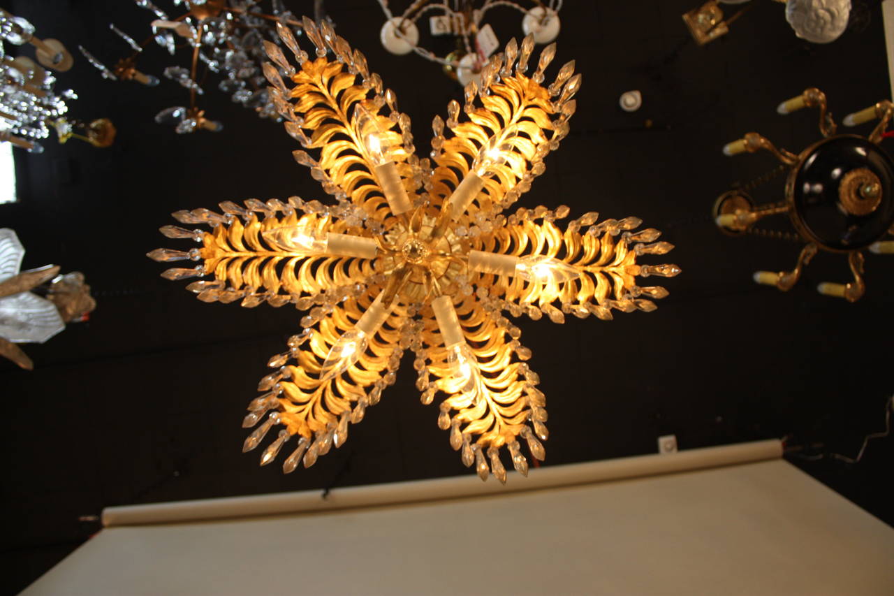 A gilt bronze and crystal palm tree chandelier. This six branch chandelier can be modified that can installed as flush mount with total height of 17