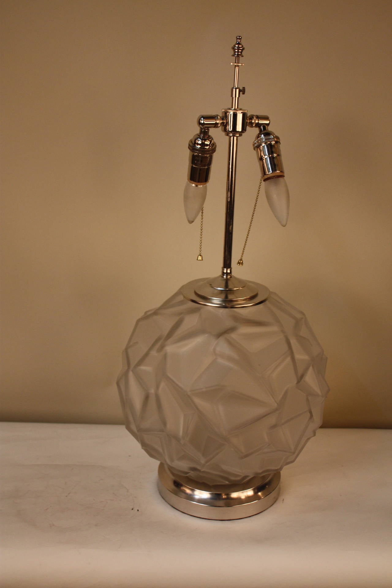 Simple but elegant Frost glass vase with geometric design which has been mounted as a table lamp with nickel base and hardware.