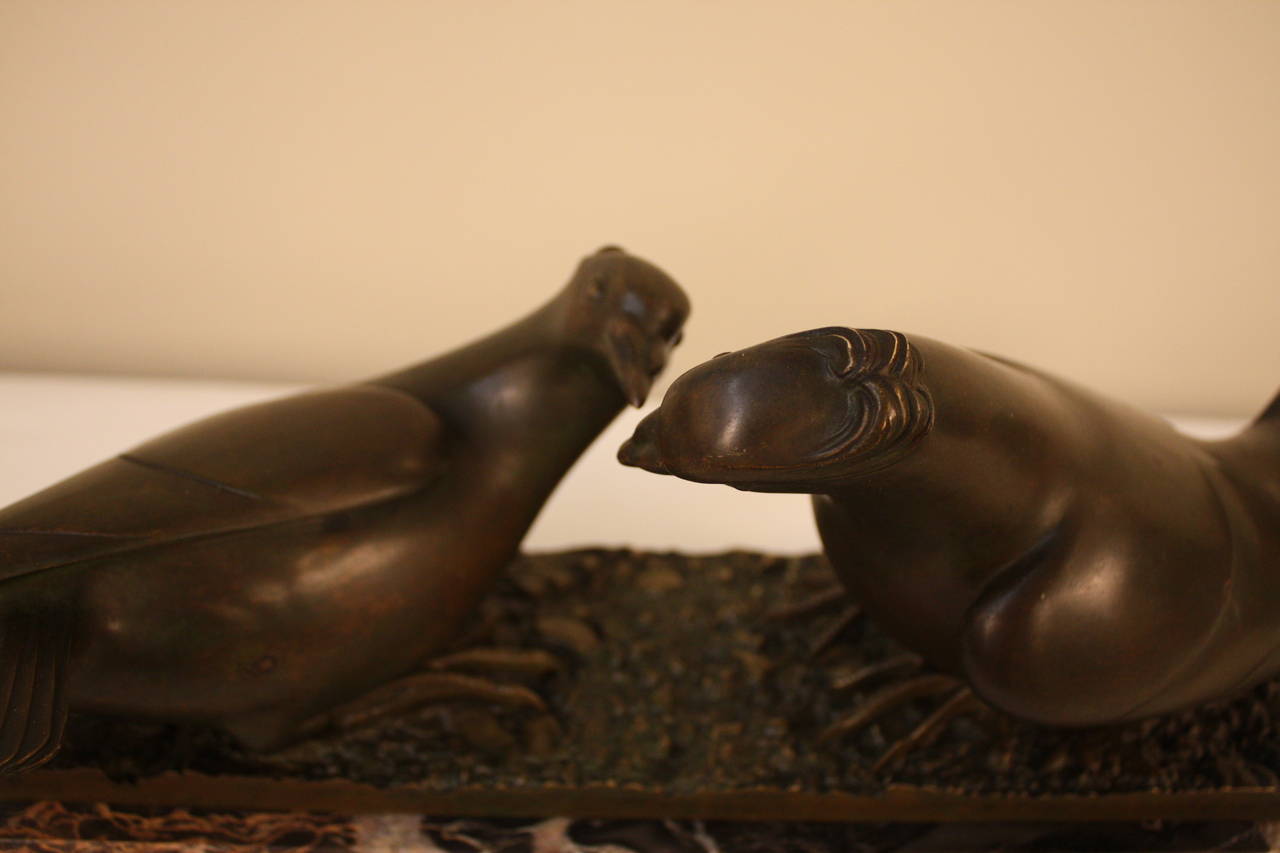 Beautifully sculptured bronze of kissing doves which is symbols of love, peace.