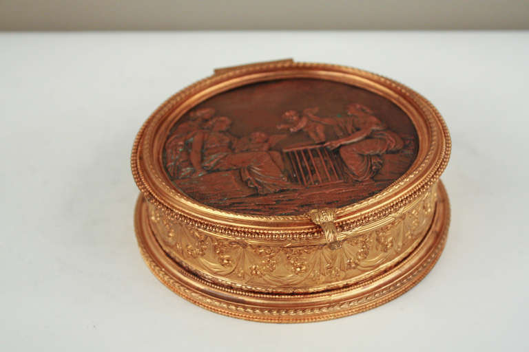 An ornately crafted piece, this keepsake box was made in France during the late 19th century and features a two tone bronze design with a beautiful brown patina. Gilt bronze and copper further accent the box with a sophisticated elegance.