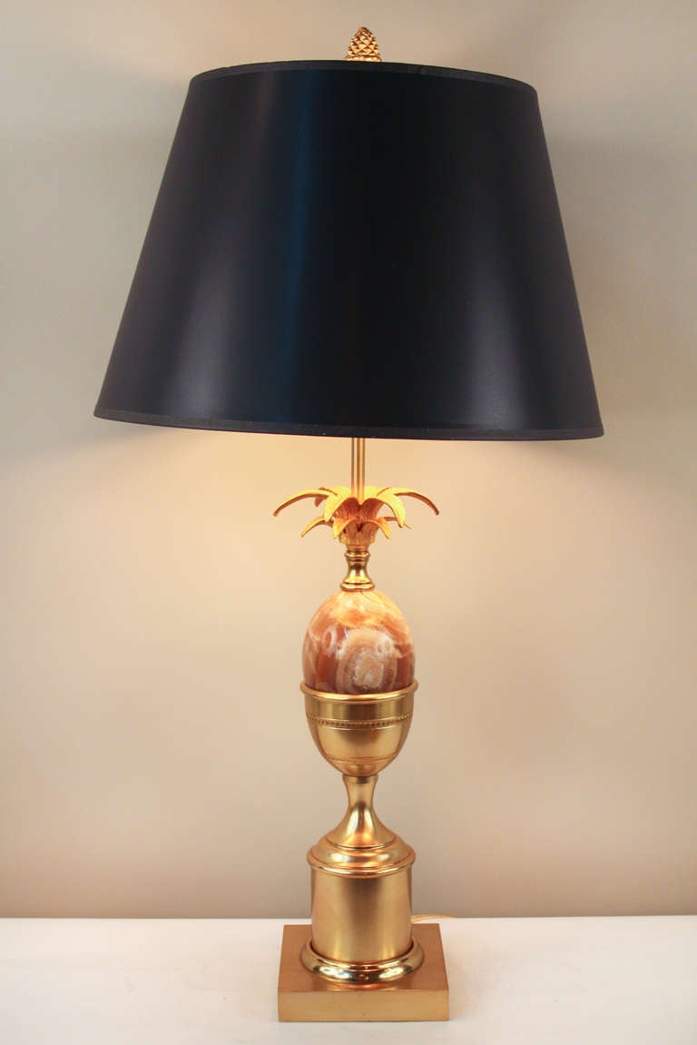 Masterfully crafted by the world renowned designers at Maison Charles in France, this table lamp is a true work of art. Made of beautiful bronze, this superb three light table lamp features a gorgeous marble centerpiece and bronze leaves, a classic