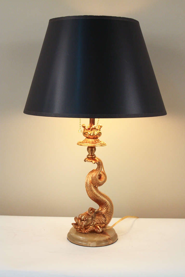 This unique table lamp from France features a gorgeous bronze koi fish design. A custom made piece, this table lamp features exquisite detail work; making it truly one of a kind.