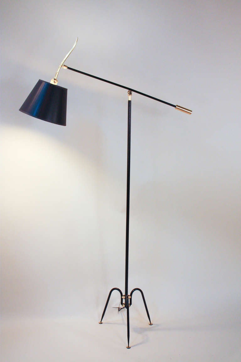 Originally from Italy, this floor lamp is absolutely gorgeous. Elegant yet simple, this versatile piece features two adjustment points: one at the center column that adjusts the height of the light, and one to adjust the pitch of the shade.