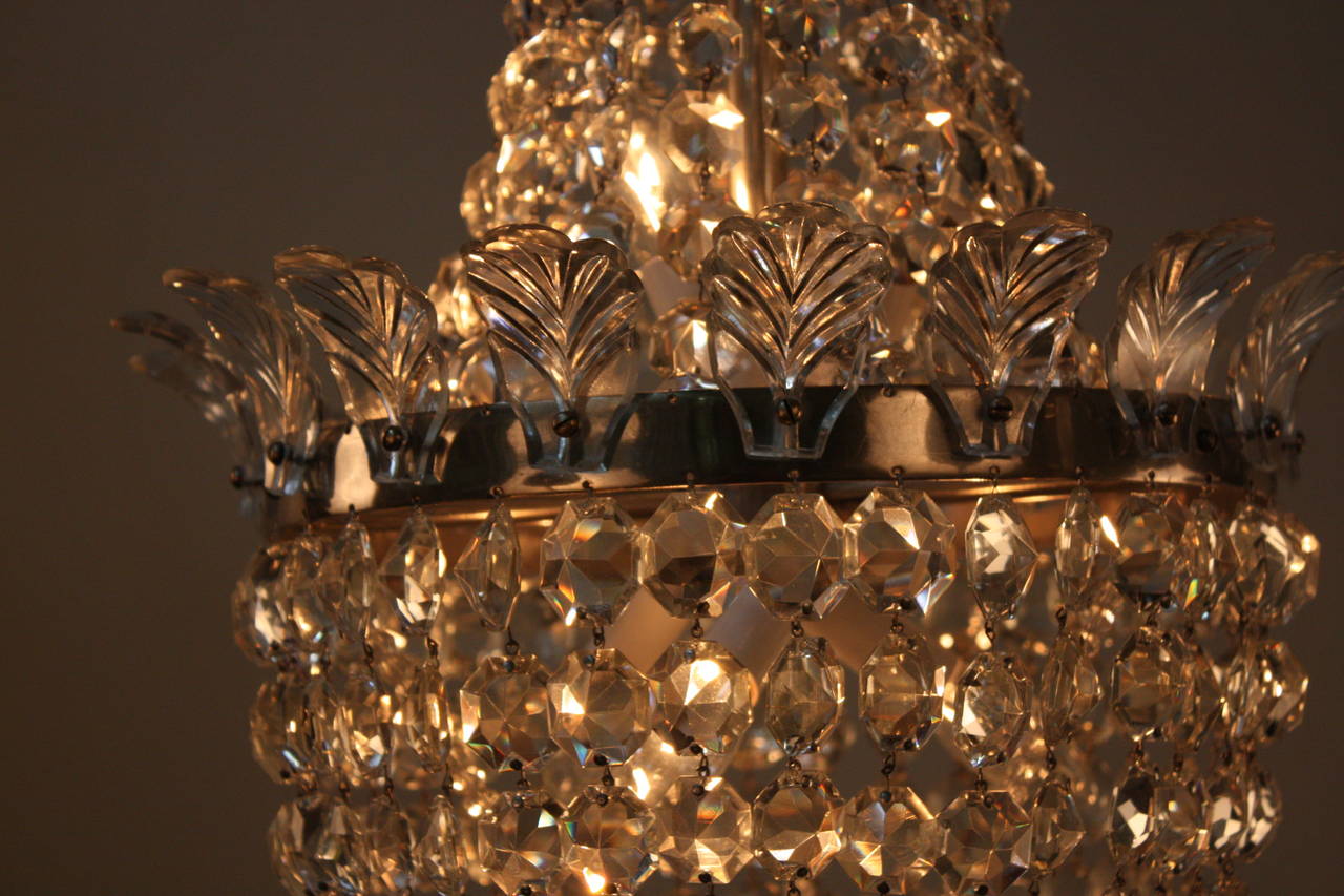 Hundreds of ornate crystals adorn this spectacular chandelier, creating an elegantly timeless look.