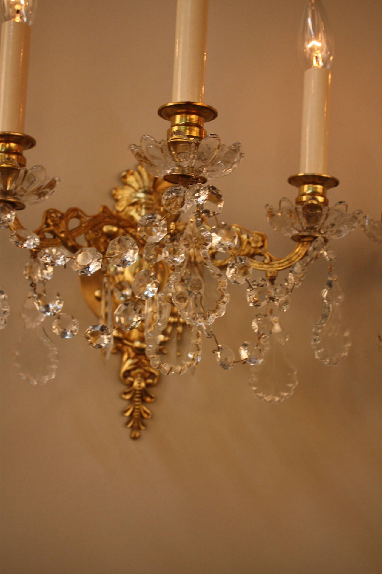 Electrified 19th century French bronze and crystal wall sconces.