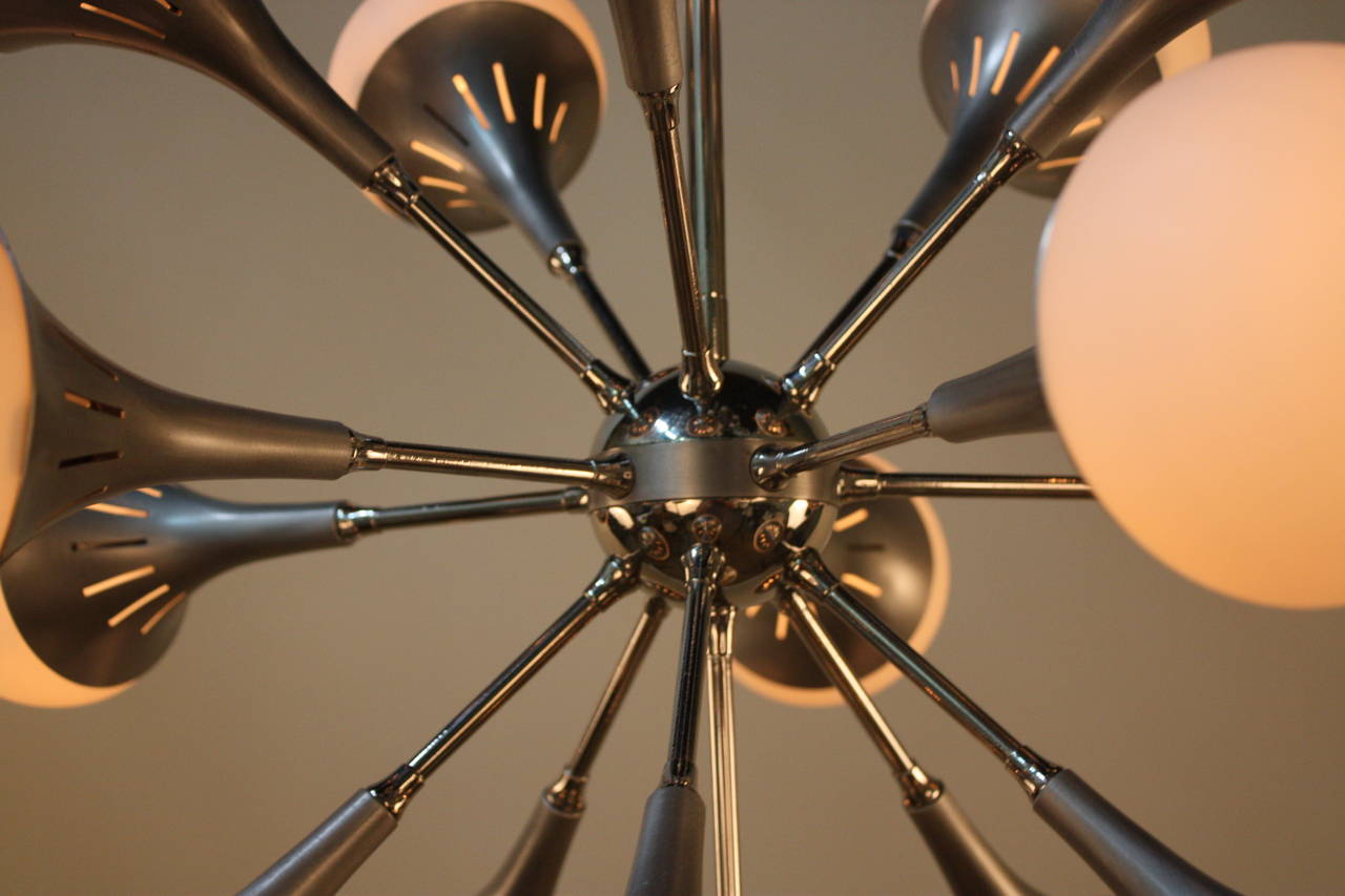 Gorgeous sixteen-light Sputnik chandelier in chrome and brushed aluminum.