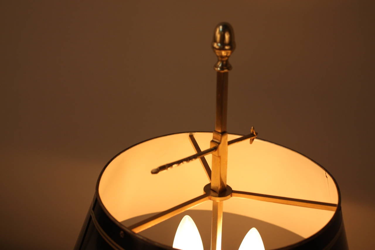 A beautiful bronze French Empire bouillotte lamp, with adjustable shade.
This lamp has three lights max 60 watt each.
