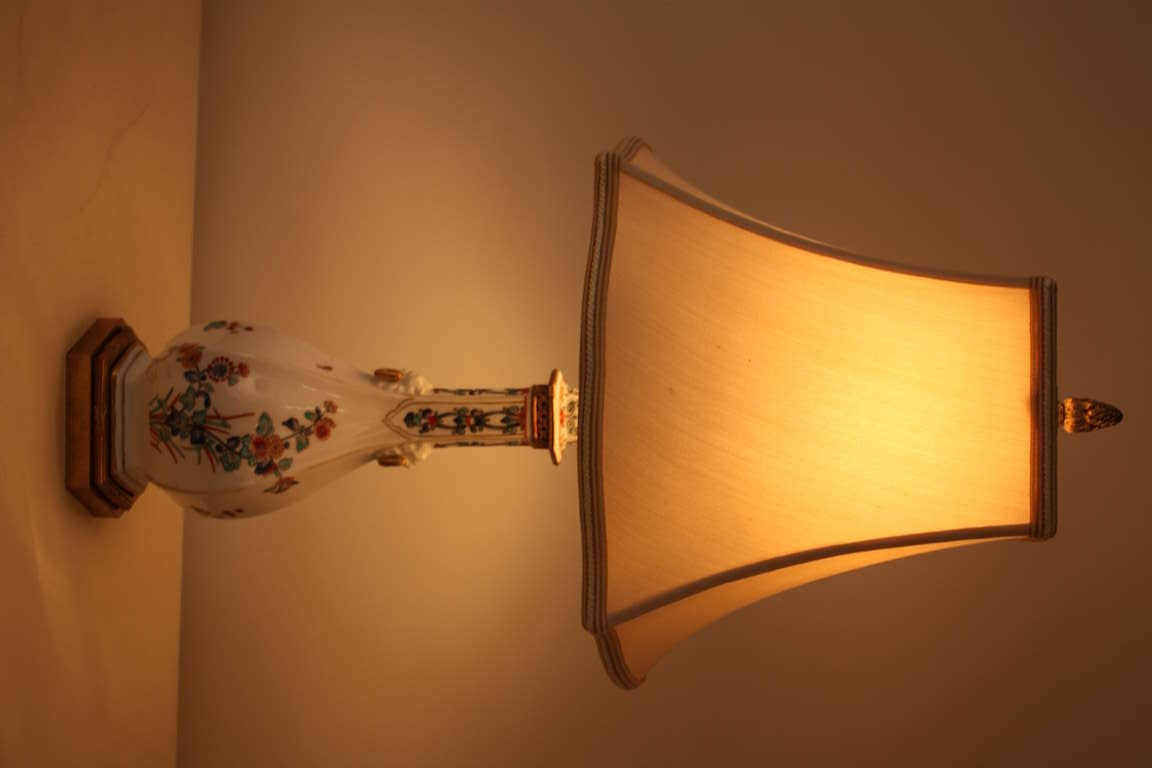 A beautiful hand painted Limoges porcelain lamp. Classic bronze mounting makes this piece absolutely stunning.