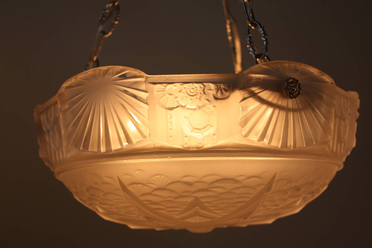 Highly stylized with geometric pattern art deco pendent / chandelier by Muller Freres with nickel on bronze hardware.