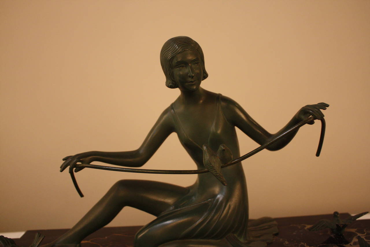 Bronze sculpture of woman with bird c 1920's by famous Hungarian artist Zoltan LiszaiI-Kovats that live in France/Belgium