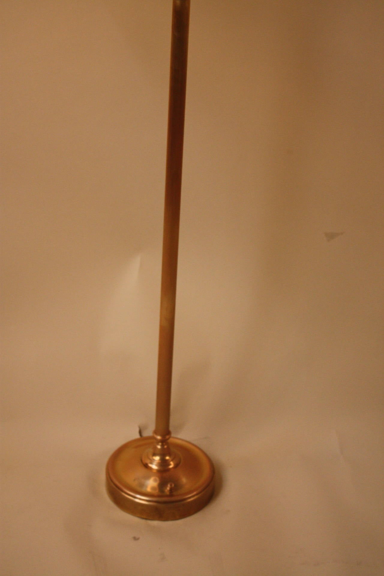 Simple but elegant swing arm adjustable height bronze floor lamp.
Height is 57