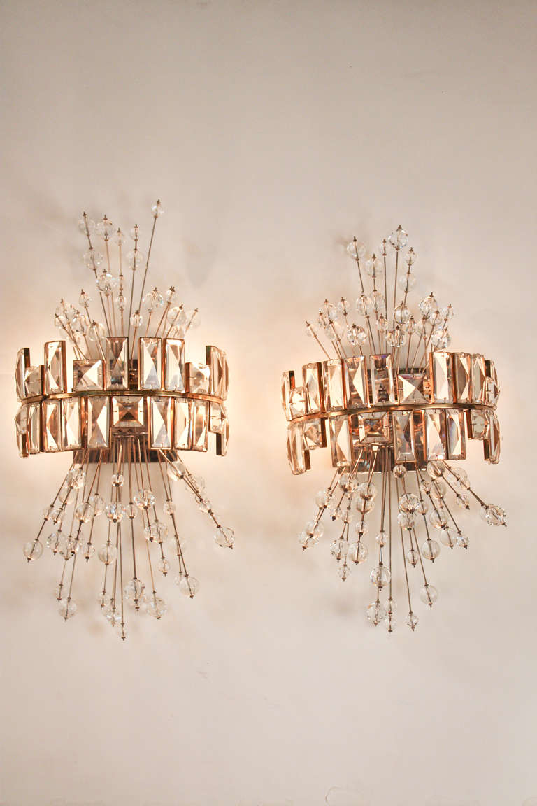 Made by the renowned Austrian glass maker Lobmeyr, these crystal wall sconces are simply stunning. Lobmeyr is known for his phenomenal glass work, and the elegance of these pieces have been displayed in prominent places such as the Metropolitan
