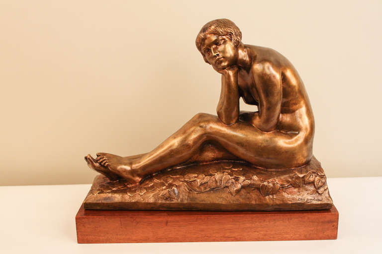 This lovely 1920-30's French bronze statue by S. Lerc depicts a nude woman sitting on bed of leaves. It features incredible natural detail among the leaves, and the woman looks out, beautiful and calm. This bronze has been cast by Susse Foundry