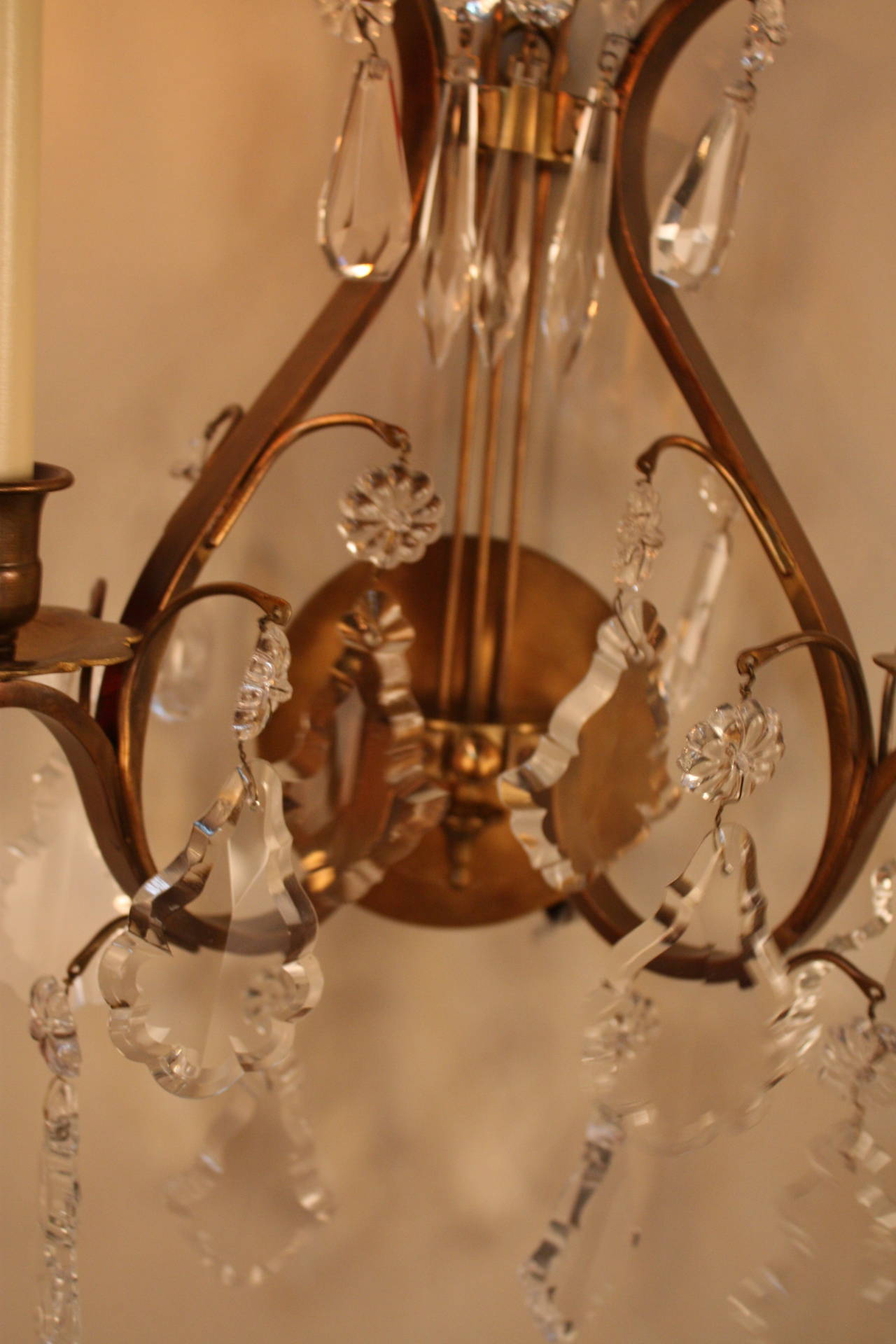 Wonderful pair of French crystal and bronze wall sconces.