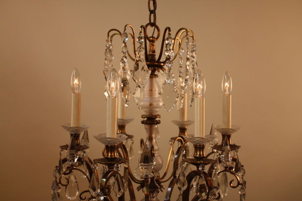 VERY ELEGANT SPANISH BRONZE AND CRYSTAL SIX ARMS CHANDELIER WITH HAND CUT ON FROST GLASS CENTER COLUMN AND BOBESCHES