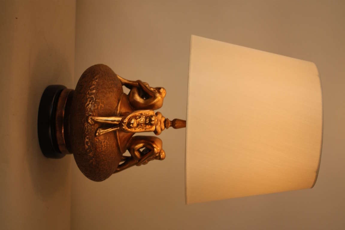THIS GORGEOUS LAMP HAS STRONG ORGANIC ELEMENT AS WELL AS ART NOUVEAU INFLUENCE BY SOFTLY THREE NUDE  WOMEN SITTING ON ON TOP OF THE LAMP BASE.