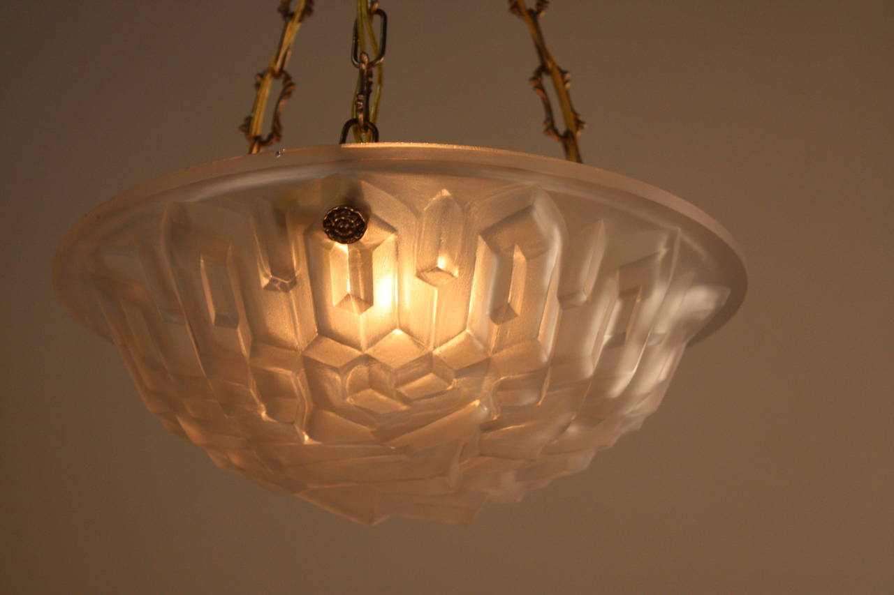 A fabulous three-light French geometric design Art Deco chandelier by Degue.
