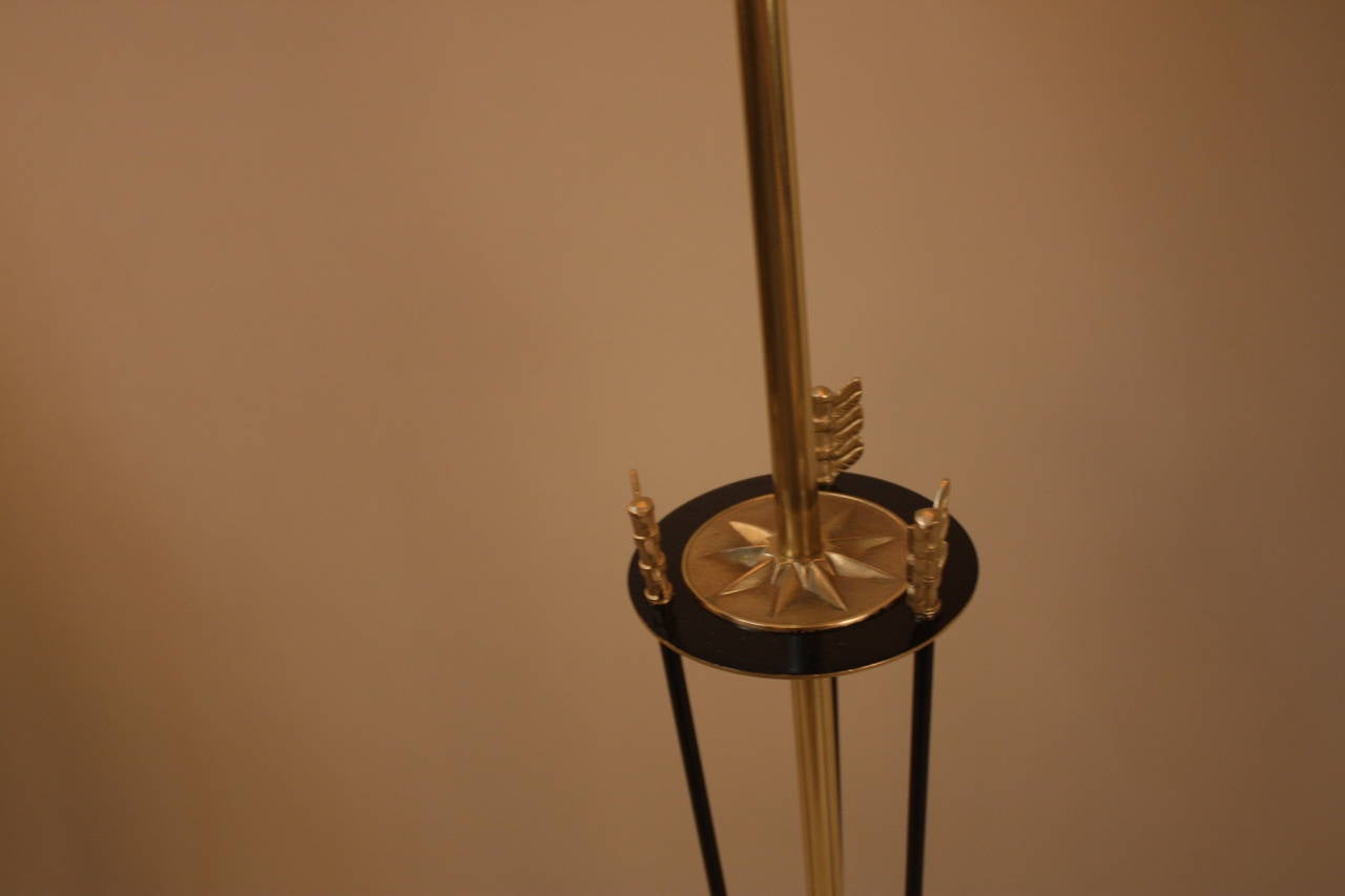 A bronze Empire floor lamp with three arrows as a center column of the lamp.
This elegant floor lamp has three individual lights for your desirable lamination as well as adjustable height.