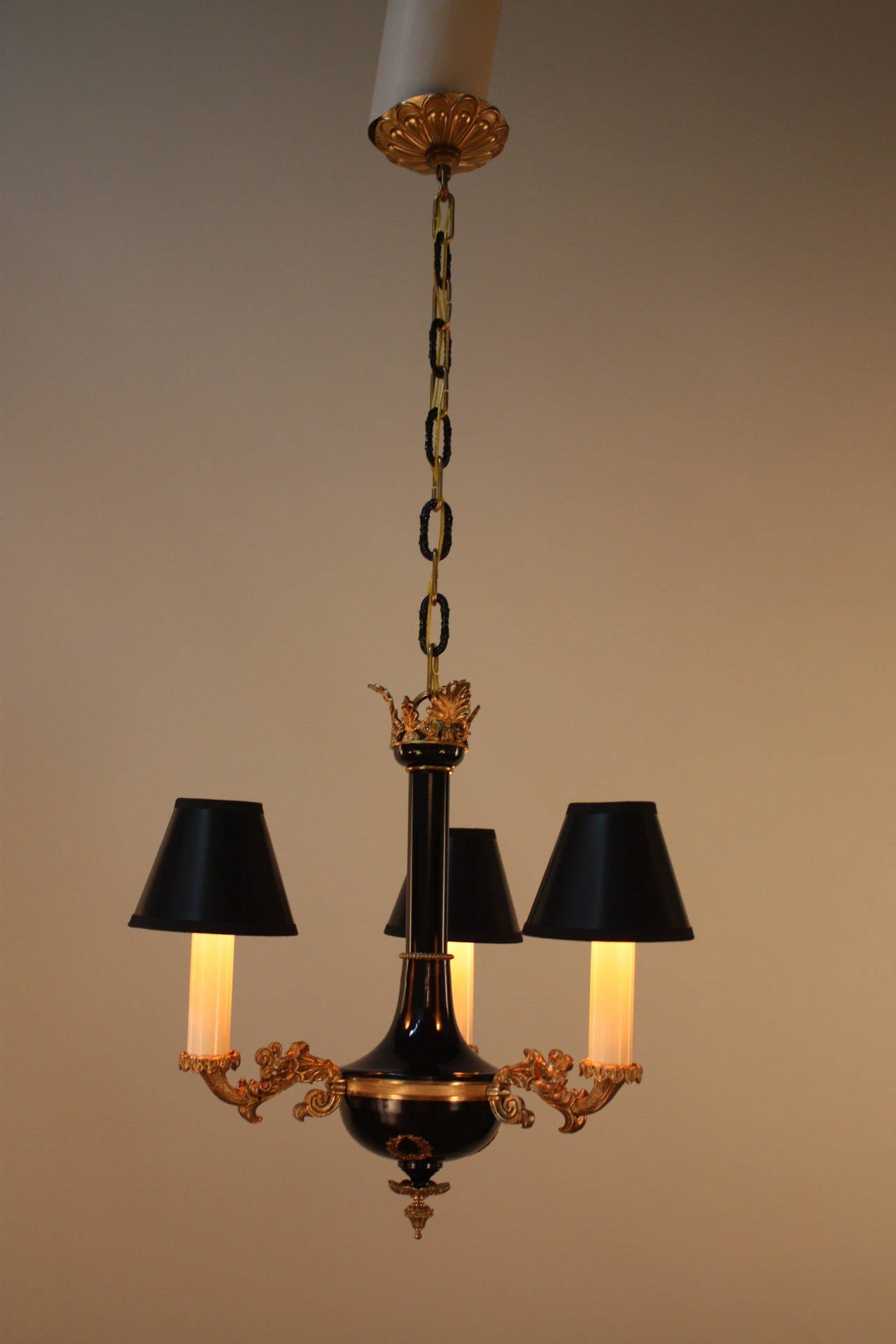 Elegant three-light French bronze Empire chandelier.