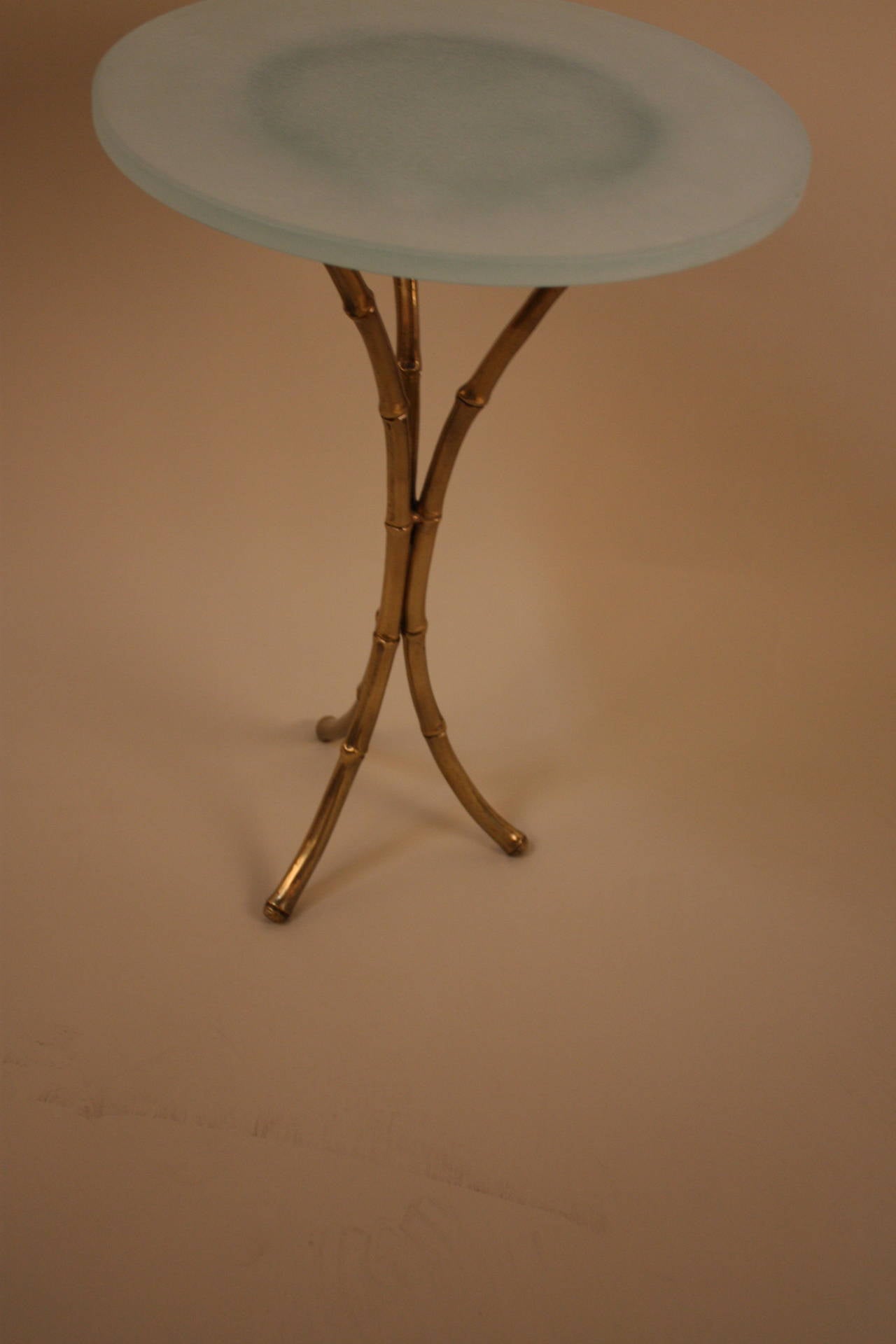 Fabulous small faux bamboo bronze table with frost glass top.