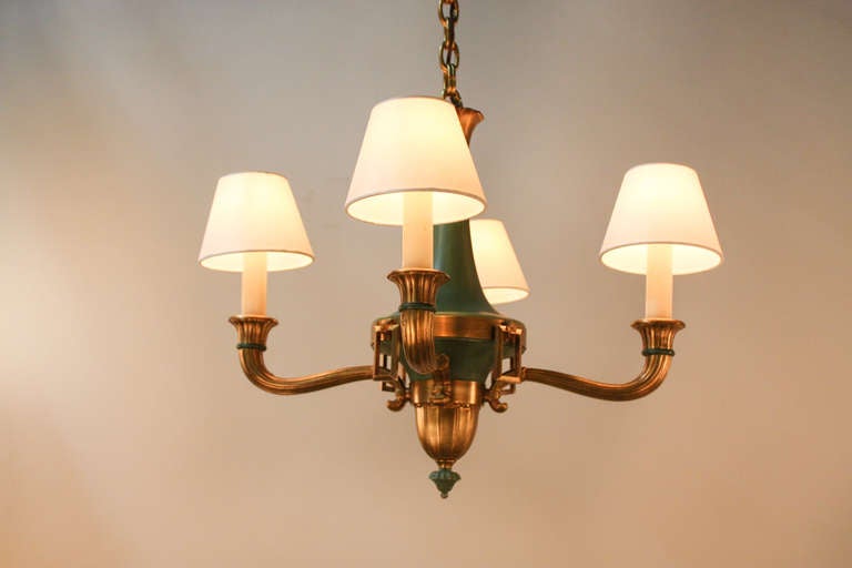 This charming French chandelier features a beautiful bronze and verde green on metal design. This elegantly crafted chandelier was made by the noted French designer Atelier Petitot, and is a fabulous example of his superb artistry.

The diameter