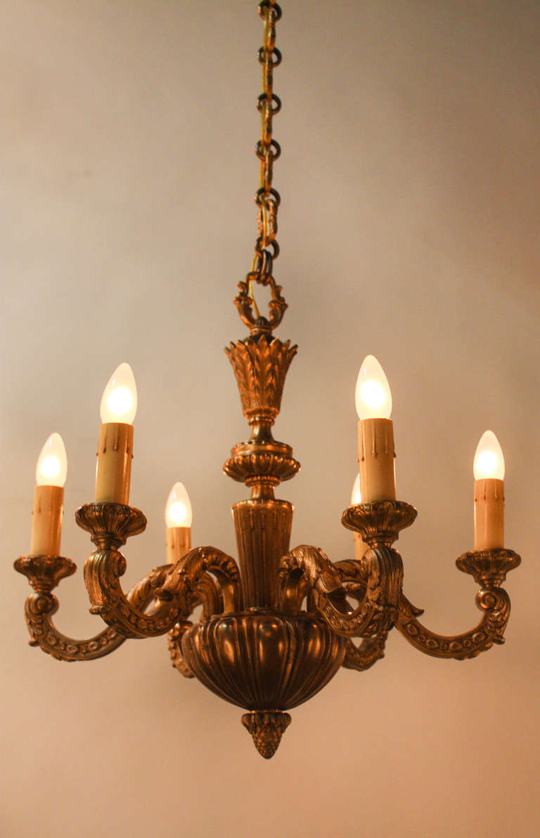 A beautiful heavy bronze chandelier.  Made in France during the 1920s, this six light chandelier features superb detail work. This chandelier measures 23