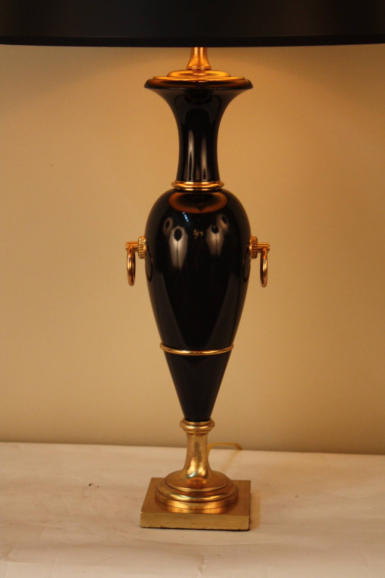 Simple but elegant Mid century black lacquer wood and bronze table lamp.