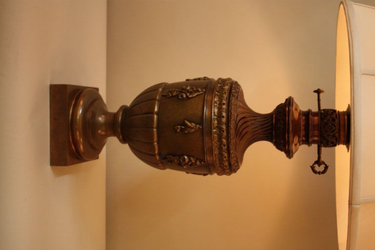 Made in the 19th century, this former oil lamp has been electrified for appreciation in the modern era. Crafted in France and made of bronze, this table lamp is truly unique.