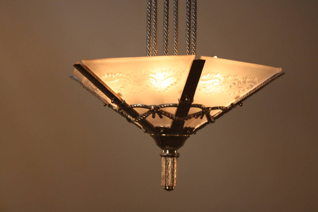 A fantastic Art Deco chandelier by Verrerie des Muller. Made in France during the 1930's, this chandelier features six beautiful frost glass panels and a classic nickel on bronze body.