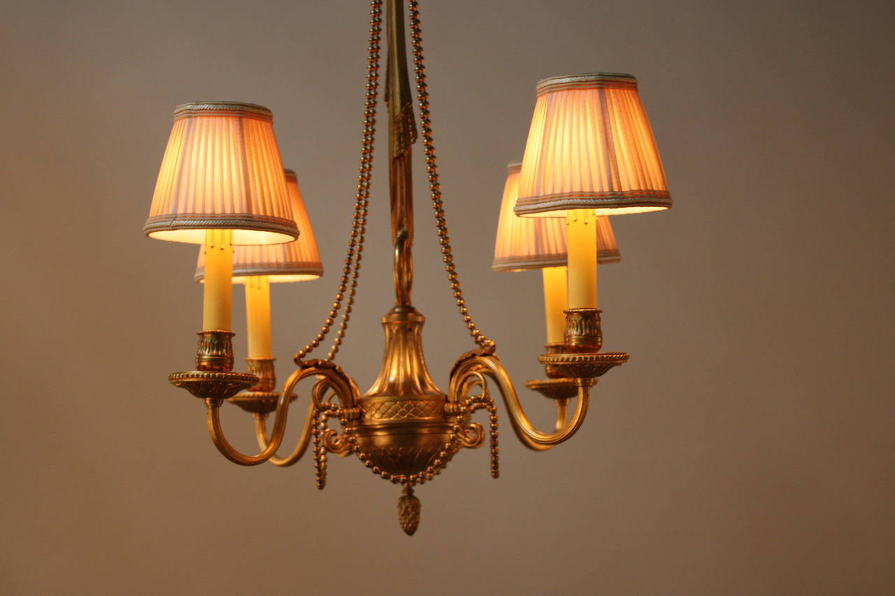 A beautiful Classic design four-light French bronze chandelier.