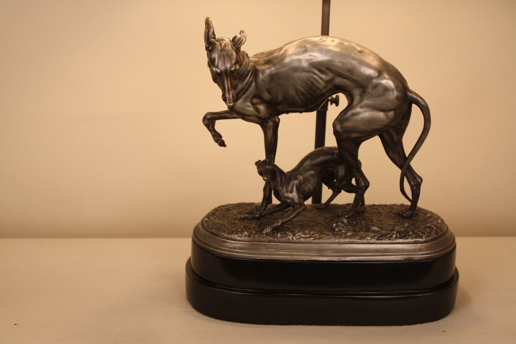 Great custom made lamp. This piece features an ornately detailed sculpture of a dog and her pup.