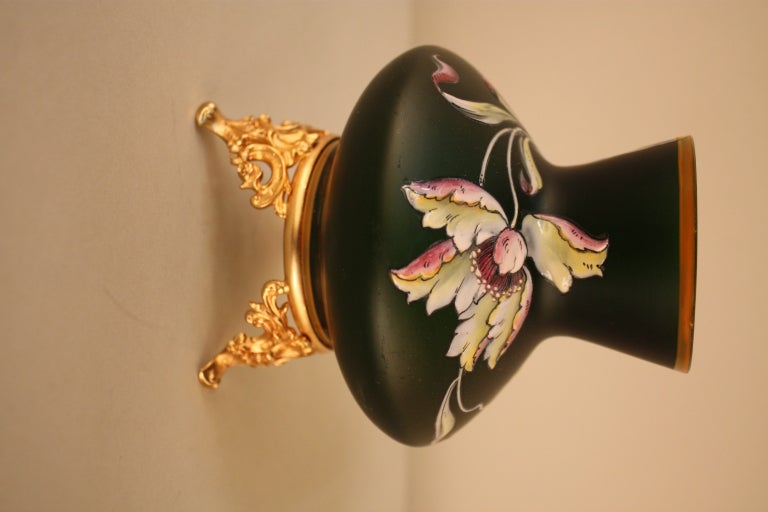 A beautiful hand-painted vase with a bronze base. Crafted in the Art Nouveau style around the turn of the last century, this vase is a true work of art.