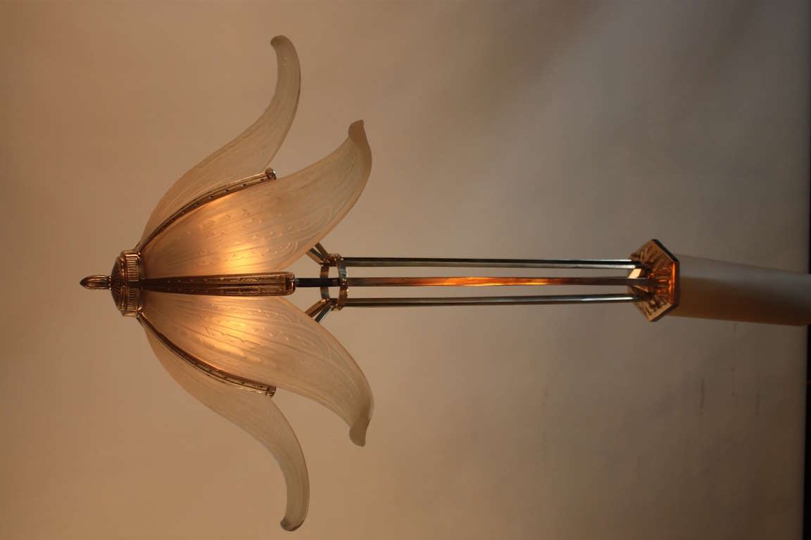 A fantastic Art Deco chandelier by Verrerie des Hanots. Made in France during the 1930's, this chandelier features six beautiful curved glass panels and a classic nickel on bronze body.