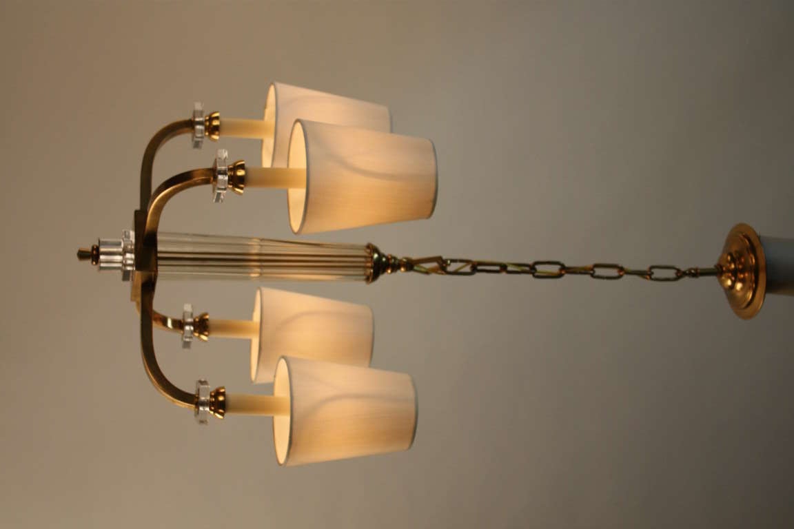 Simple but elegant four arm bronze and glass chandelier by  modernist designer Jacques Adnet