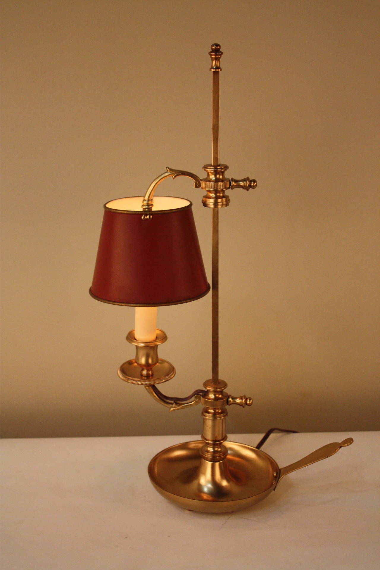 Made in France during the early 20th century, this artisanally crafted table lamp is truly beautiful. Made of gorgeous bronze in the Empire style, this single-light table lamp features adjustable height and a hand-painted shade creating an elegant