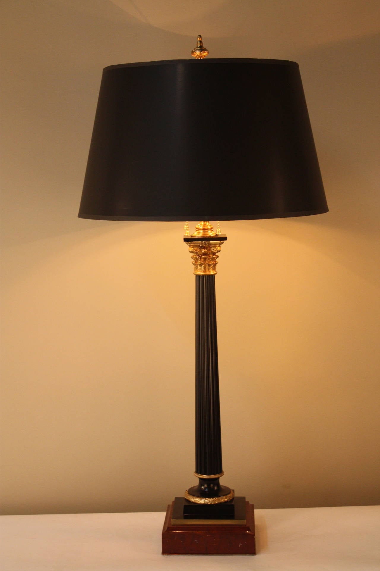 This fantastic French table lamp originally served as base for an oil lamp in the 19th century. It has been custom converted and electrified, and is now an electric table lamp with three American sockets. 

While it may not burn oil anymore, this