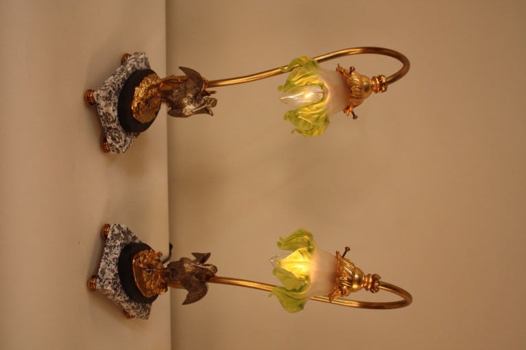 THIS PAIR OF RARE FRENCH LAMP BELIEVE TO BE CUSTOM MADE . IT START WITH A SILVER ON BRONZE BIRD STANDING IN FRONT OF A TREE TRUNK WHICH IS BRONZE DORE. SHADES ARE HAND BLOWN GLASS .