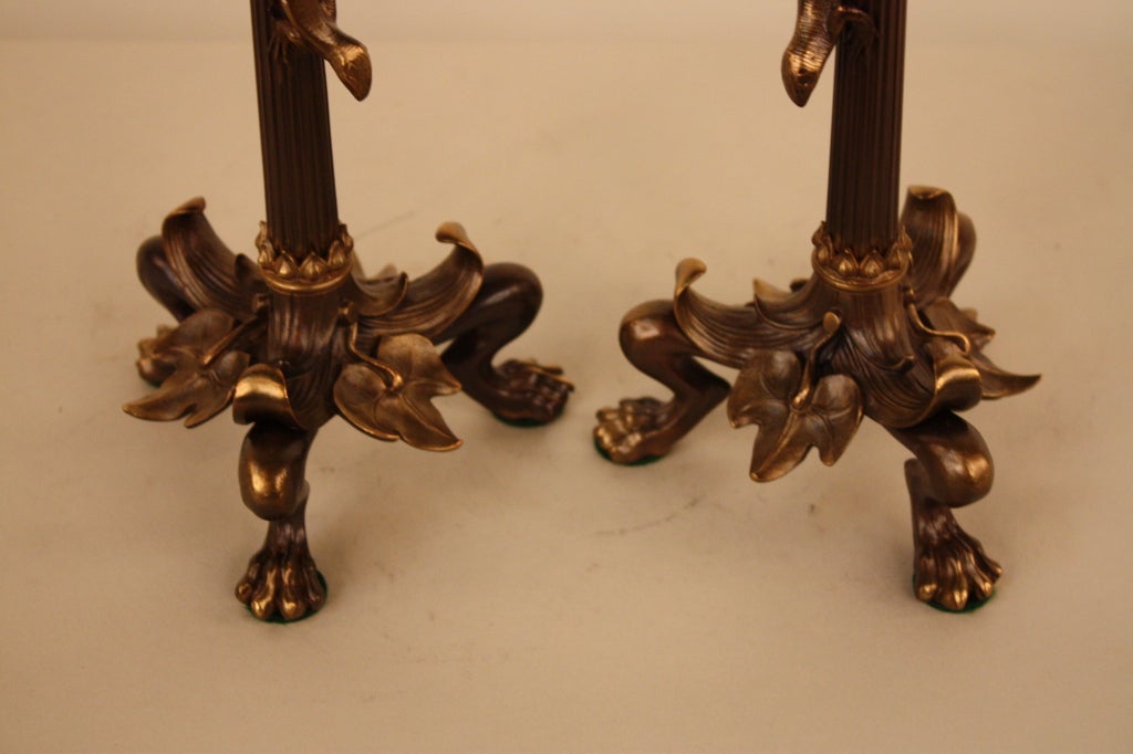 PAIR OF FRENCH 19TH CENTURY BRONZE CLAWFOOT CANDLE STICKS.