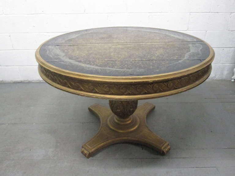 Hollywood Regency Eglomise Top Center Table with lovely carved wood base.