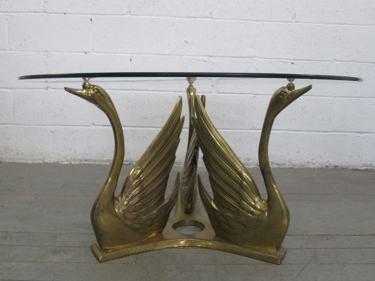 Wonderful trio of brass swans mounted on brass reverse trefoil base.

