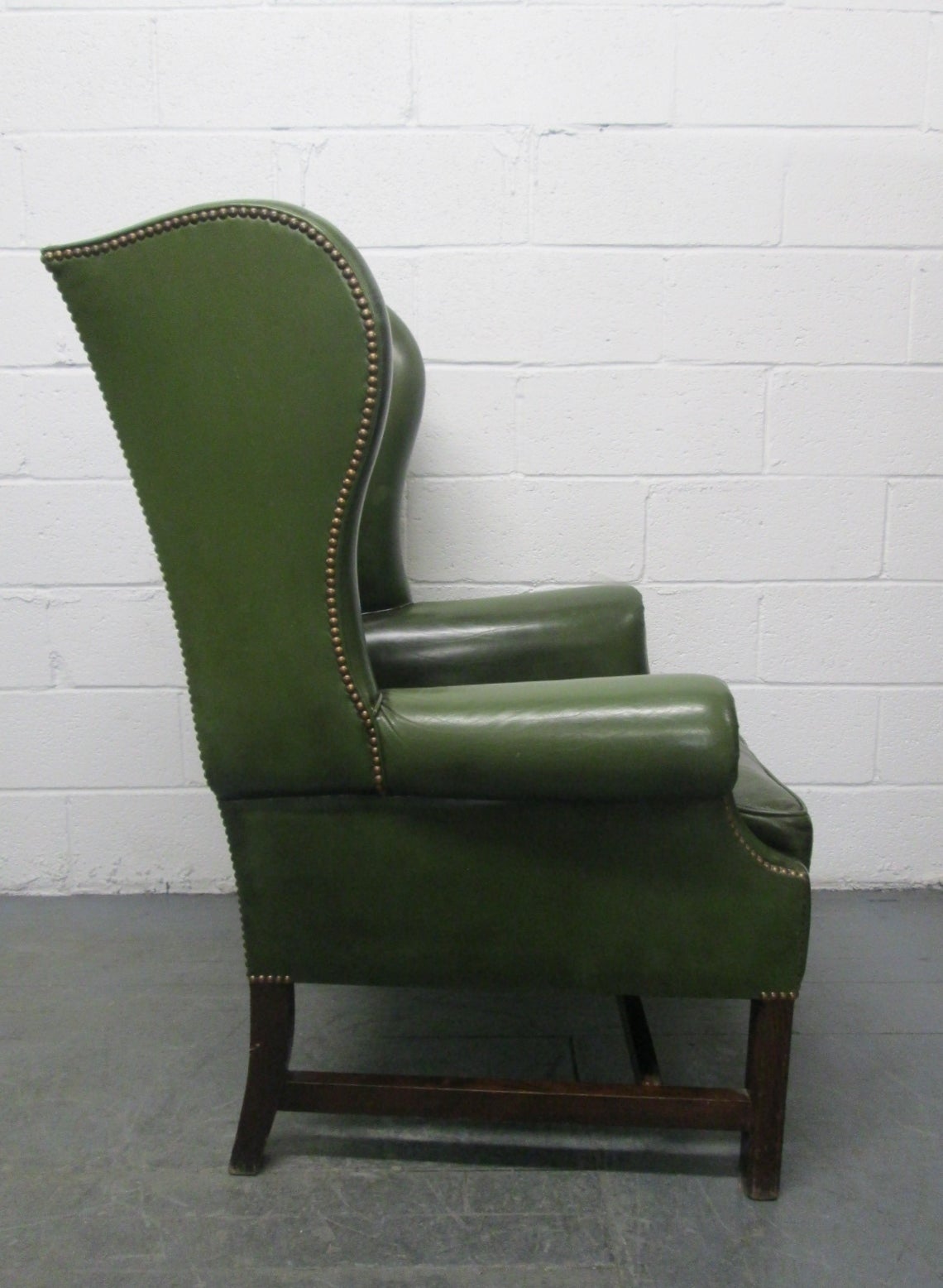 green leather wingback chair