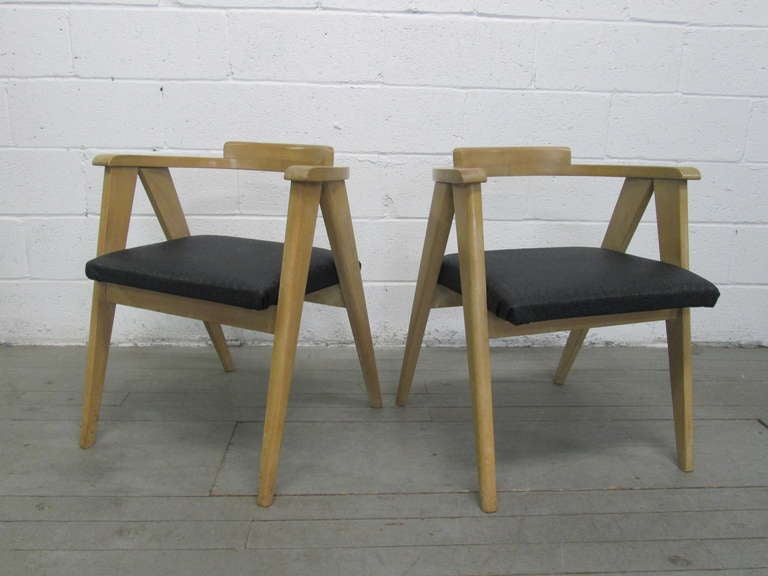 Pair of Allan Gould for Herman Miller Compass chairs with wood frames and a faux reptile skin black vinyl seat.