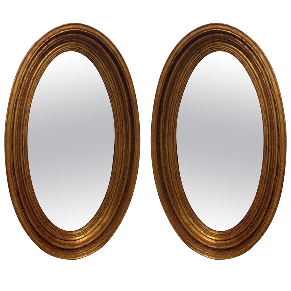 Pair of Gold Gilt Oval Mirrors