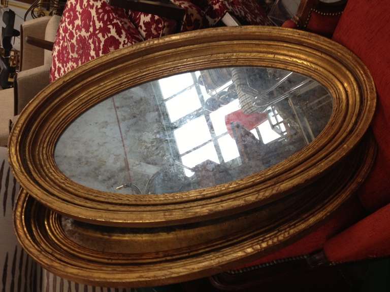 Pair of Gold Gilt Oval Mirrors 1