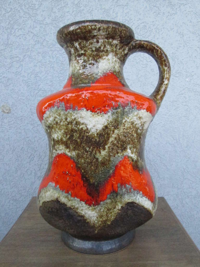 Wonderful pottery vase by Scheurich with awesome vibrant orange, brown and white colors.