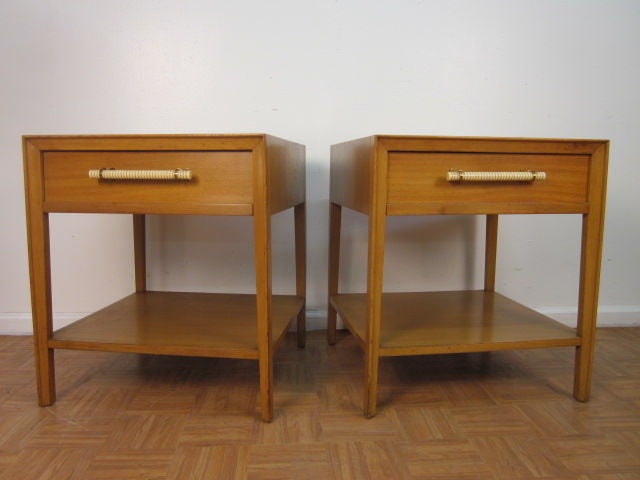 Mahogany nightstands / bed side tables by John Widdicomb.  Has a finished back. Well designed with Bakelite and brass handles.